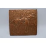 Copper Art Nouveau embossed plaque depicting a horse and rider. 22 x 20cm.