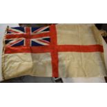 A vintage British White Ensign ship's flag with rope. No makers mark etc. Approx 130 x 66cm.