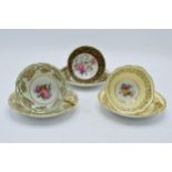A trio of Paragon Fine Bone China cups and saucers decorated with majestic floral scenes (6 pieces).