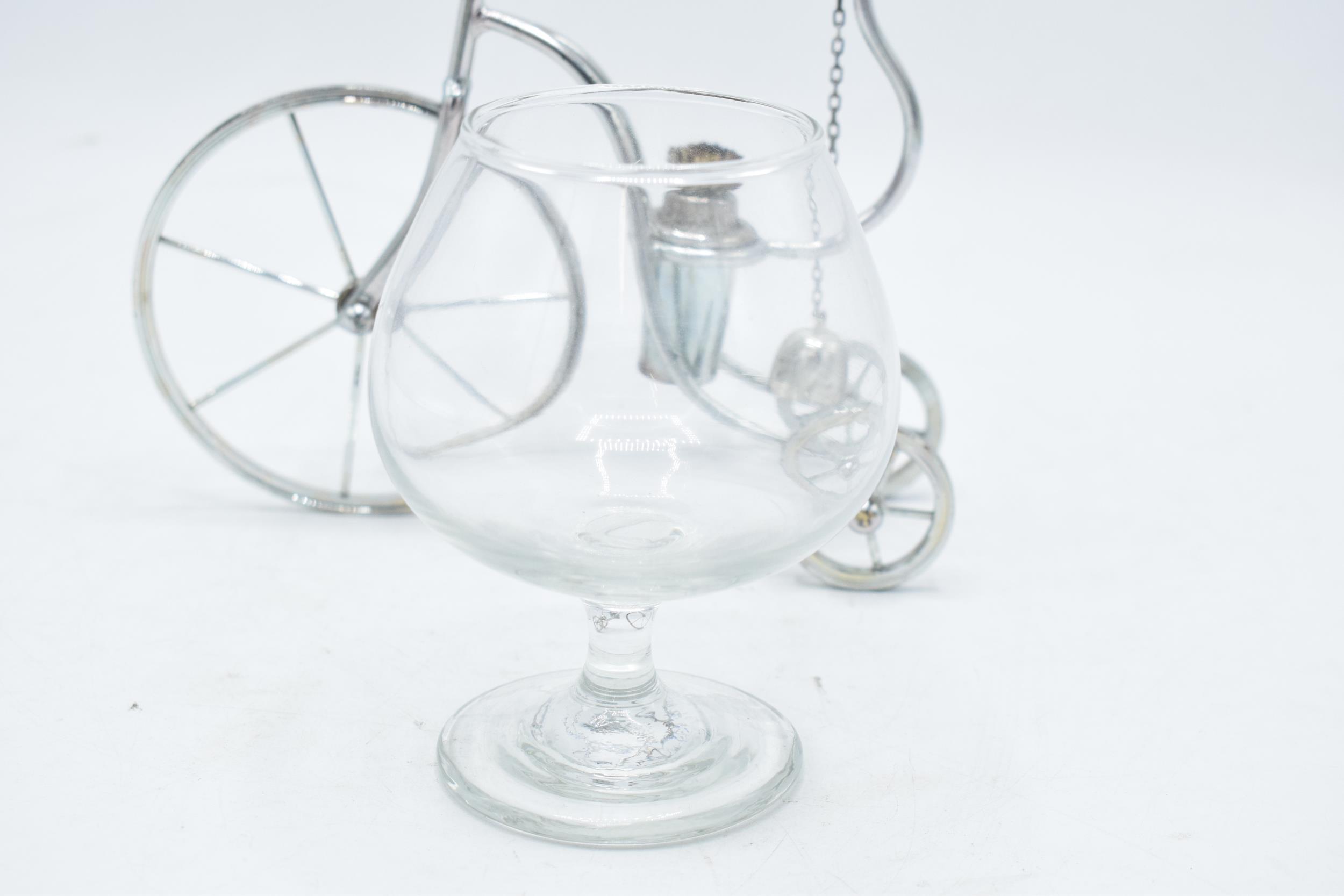 A novelty silver plated brandy warmer in the form of a tricycle / penny farthing style with a glass. - Image 5 of 5