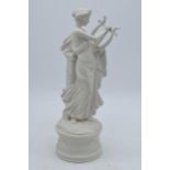 An unusual Coalport figure of a robed lady playing the harp in a Parian / Wedgwood style. 27cm tall.