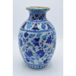 A 19th century blue and white pottery Iznik or similar vase with crackle glaze effect. 25cm tall. In