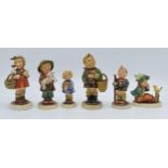 A collection of Goebel / Hummel figures to include Girl with Flowers, boy with chick, girl with