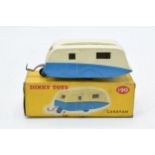 A Dinky Toys No. 190 Caravan comprising of cream and blue body with cream hubs. In good condition
