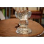 A small glass candlestick, in the style of Timo Sarpaneva / Whitefriars. 9.5cm. In good condition.