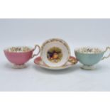 Aynsley Orchard gold items to include a cup and saucer together with 2 different coloured cups (