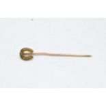 9ct gold stickpin in the form of a horseshoe. 0.6 grams. 4.5cm long.