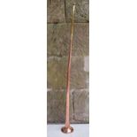 Victorian copper hunting horn with brass mouthpiece and neck. 91cm tall. In good condition with some