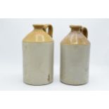 A pair of vintage two-tone stoneware flagons. 27cm tall. Both are cracked.