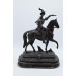 A large 20th century bronzed spelter figure on wooden plinth of a horseman / cavalry. 34cm tall.