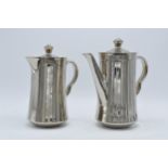 A pair of Royal Worcester silver pottery tea and coffee pots (2). In good condition with no