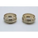 A pair of silver napkin rings with floral decoration. 16.1 grams. Chester 1923.