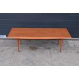 A mid century / retro Gordon Russell teak coffee table on tapered legs. 122 x 47 x 40cm. In good