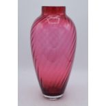 A large vintage cranberry glass with swirling decoration, 35cm tall. In good condition with no