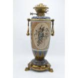 Doulton Lambeth Florence Barlow stoneware oil lamp base with brass tri-leg stand in the form of