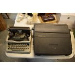 A pair of typewriters to include a Codeg typewriter and a Sharp PA-3100S electric typewriter (2).