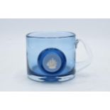 Wedgwood blue glass tankard with blue Jasperware cameo insert. 9cm tall. In good condition with no