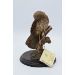 Boxed Country Artists model of a bird perched on a branch and foliage. In good condition with no
