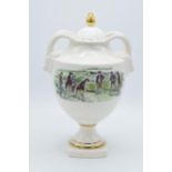 St. James China urn depicting gentleman in 18th century clothes playing golf with goat's head