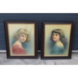 A pair of early 20th century prints of young girls in wooden frames (2). 61 x 47cm inc frames.