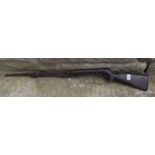 BSA .177 under-lever air rifle with walnut stock and textured grip. Serial number present but