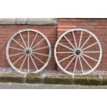 A pair of late 19th century wooden and metal rimmed cart wheels, believed by the vendor to have