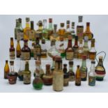 A box of vintage alcohol miniatures to include various drinks with names such as Bols, Cusenier,