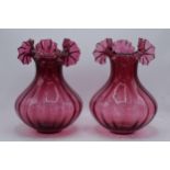 A pair of large vintage cranberry glass low-shouldered baluster vases with shaped rims (2). 28cm