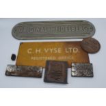 A collection of signs to include a brass example, 'Original Heidelberg' and other printing blocks (