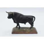 An unusual 20th century cast plaster figure of an Aberdeen Angus Bull with signature to verso.