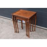 A vintage 20th century nest of 3 tables which suspend underneath each other. Largest 52 x 41 x