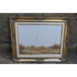 T Lukkien oil on canvas in gilt frame of mallards in flight over marshes. 53 x 43cm inc frame.