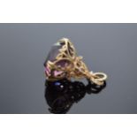 9ct gold ornate fob set with amethyst stone. 8.2 grams gross weight.