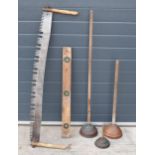 A mixed collection of vintage items to include a two-handled logging saw, a wooden spirit level