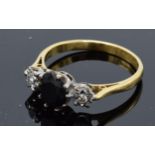 18ct gold and platinum ring set with a sapphire and illusion-set diamonds. 3.0 grams. UK size Q.
