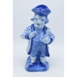 A large French pottery Toby jug decorated in a blue glaze in a Faience or Delft style with