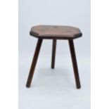 A vintage wooden tri-leg stool / milking stool with chamfered legs. 25cm tall. In good condition