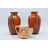 A collection of pottery to include Bretby pair of orange lustre vases, Before and After shaving