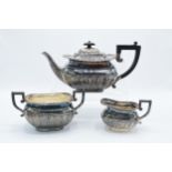 Silver tea pot together with matched silver plated sugar and cream. Teapot weighs 598.8g, bearing