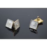 A pair of 9ct gold and platinum cufflinks with Mother of Pearl and seed pearl design (2). 5.6 grams.