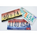 A collection of vintage American car registration plates / number plates to include Indiana and