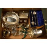 A collection of silver plated items to include cutlery sets, a basket, cream jugs, cutlery and a