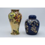 Royal Winton Grimwades floral and gilt ginger jar on dark blue background together with floral