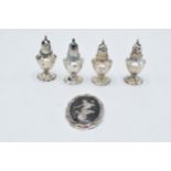 A collection of sterling silver items to include 2 cruet sets (2 slightly loaded) and a brooch (