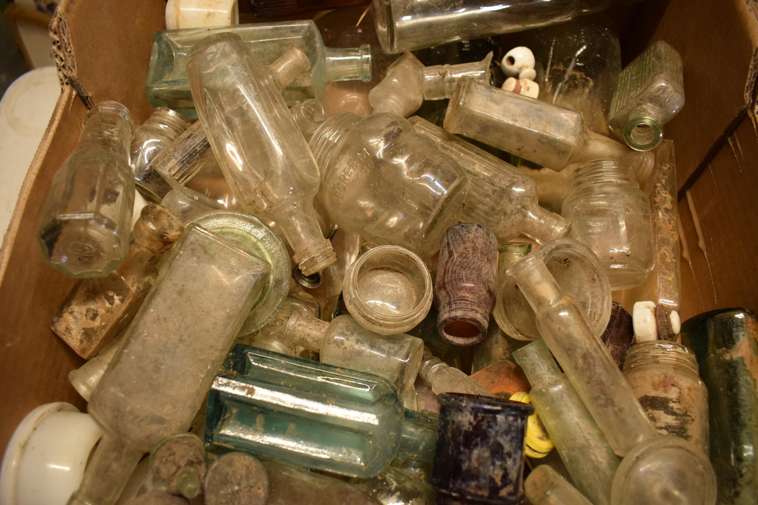 A large collection of glass bottles of varying forms and colours with some having advertising - Image 3 of 4