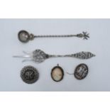 A collection of foreign silver items (lower grade) to include a spoon, long handled bread fork and 3