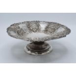 A silver pedestal dish with repousse decoration, Chester 1902, 272.2 grams. 23cm wide.