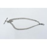 A hallmarked silver double Albert watch chain, 30.0 grams with hallmarked T-bar and metal clasp.