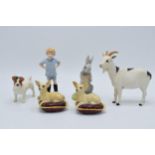 A collection of pottery to include Beswick chihuahua on cushion x 2, Jack Russell and Royal