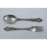 Silver (.830) ornate spoon and fork (2). 63.2 grams.